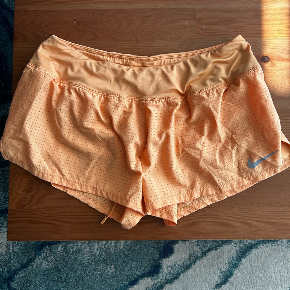 Peach mesh Nike running shorts